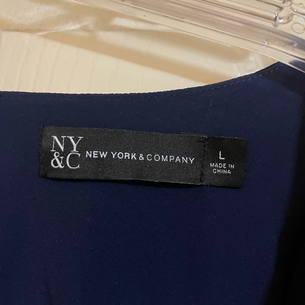 Cute baby doll dress from New York and Company.  Navy blue, size large.